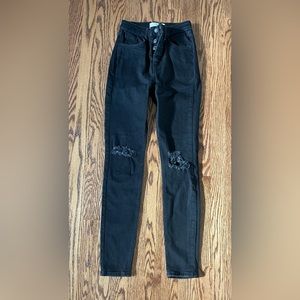 Free people black ripped skinny jeans.